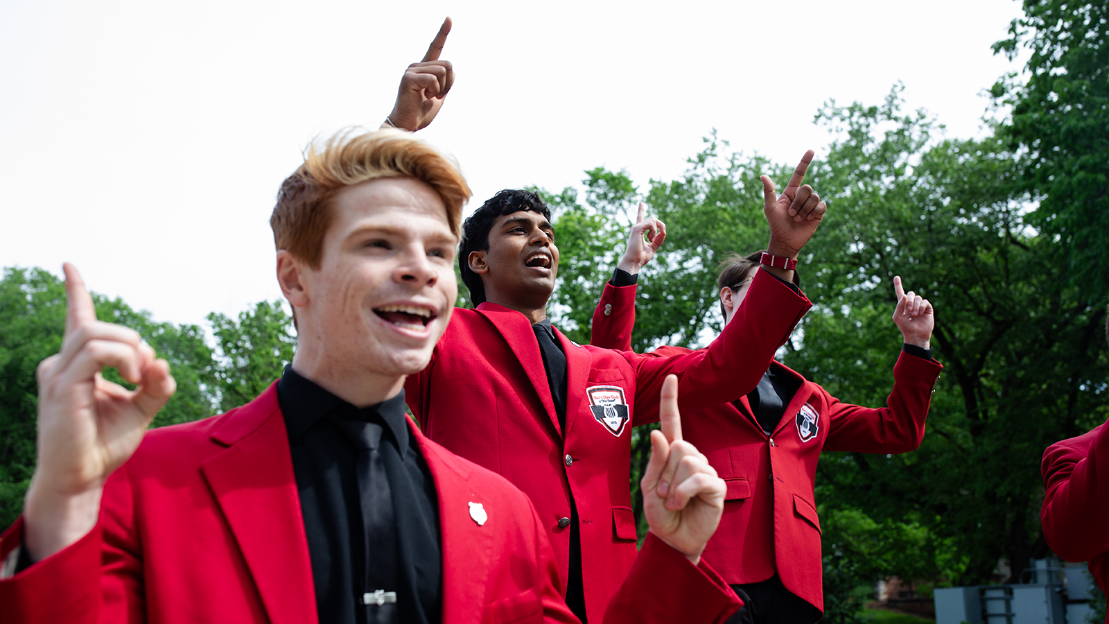 Members of the Men’s Glee Club perform the Ohio State fight song at Browning Amphitheatre.