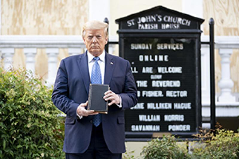 President Donald Trump holds a copy of the Bible in front of St. John's Episcopal Church just north of Lafayette Square. President Donald Trump holds a copy of the Bible in front of St. John's Episcopal Church just north of Lafayette Square.