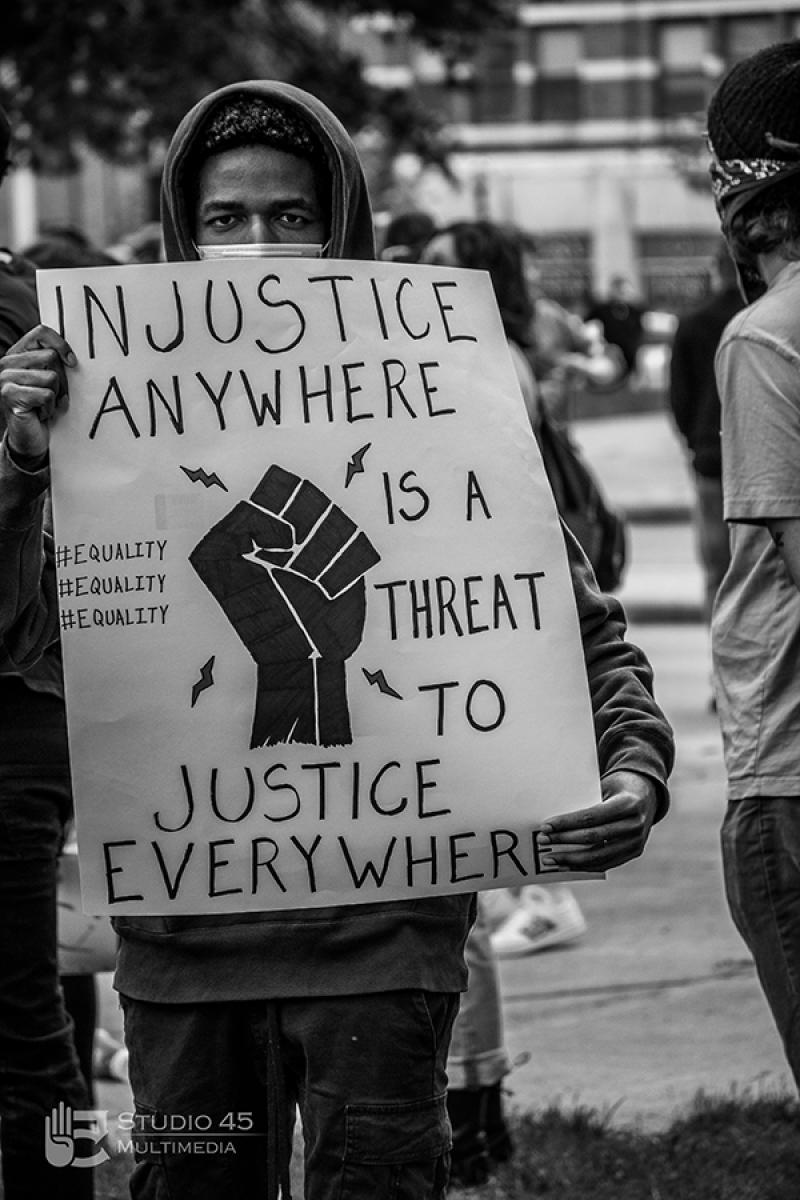 Protester holds up a sign at a Black Lives Matter protest in Mansfield in May 2020