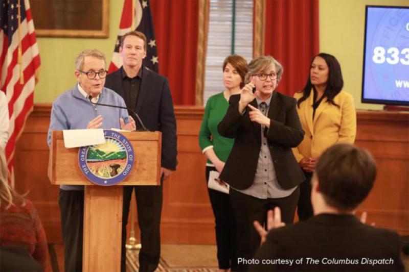 Marla Berkowitz interprets for Gov. Mike DeWine during a briefing on the coronavirus.