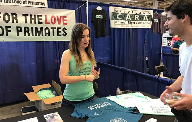 Tessa Cannon presenting information at a For the Love of Primates booth Tessa Cannon presenting information at a For the Love of Primates booth
