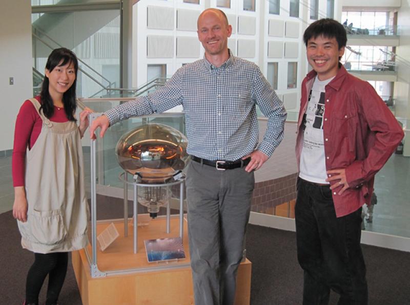 John Beacom (center) stands with former postdoc Kohta Murase (right) and Murase's wife, Chisako Murase (left)