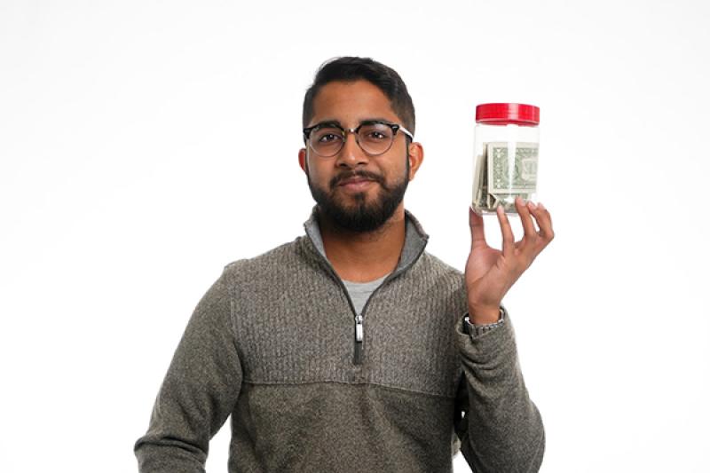 Imran Nuri holding an empty jif jar