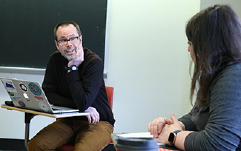 Jason Cervenec, education and outreach director at Byrd Polar, speaks with a student of Thomas Davis' English class.