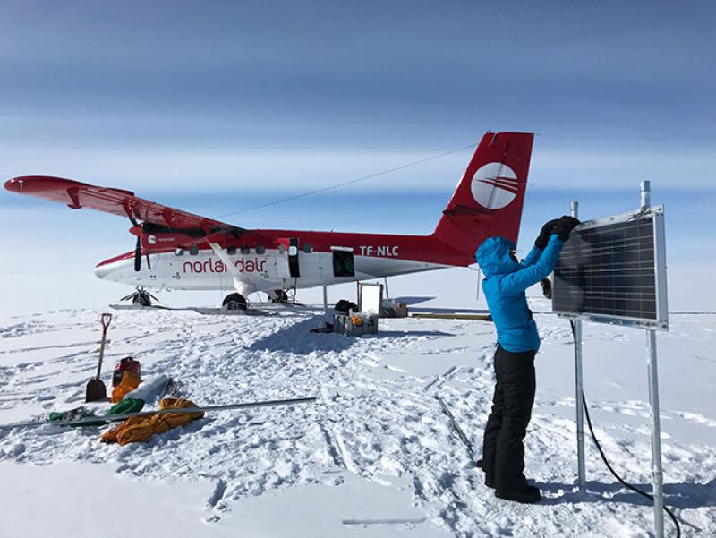 King checks on an instrument she and her team installed on the Greenland Ice Sheet in April 2018 to measure changes in surface accumulation and snow/ice compaction. King checks on an instrument she and her team installed on the Greenland Ice Sheet in April 2018 to measure changes in surface accumulation and snow/ice compaction.