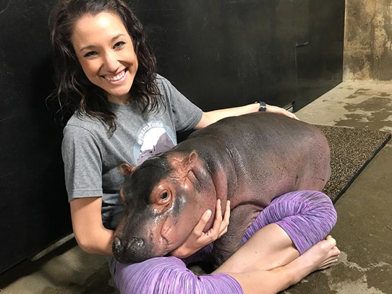 Angela Hatke with Fiona the baby hippo Arts and Sciences alumna Angela Hatke with Fiona the baby hippo.