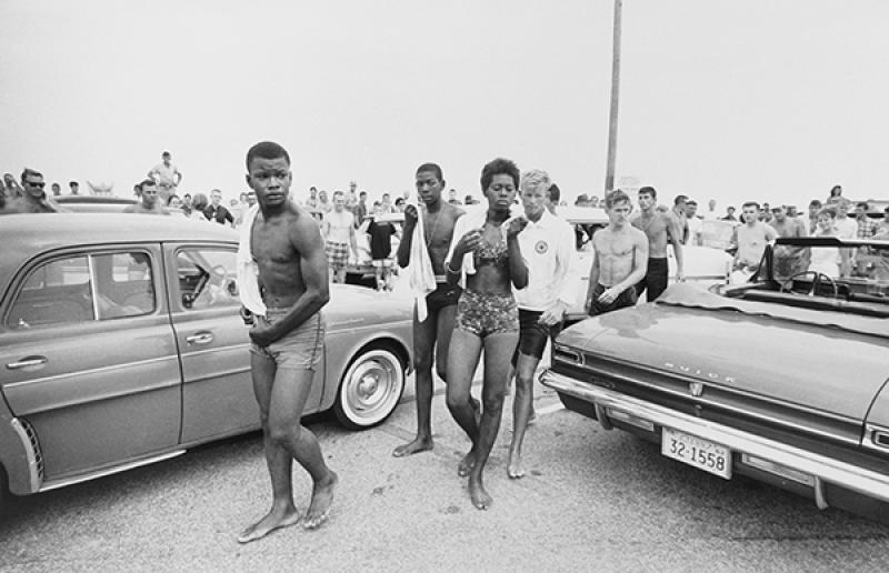 A jeering crowd follows three Black youths in 1963 A jeering crowd follows three Black youths in 1963