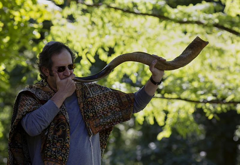 Blowing a shofar during an outdoor Rosh Hashanah ceremony in Bexley. Photo: Lauren Pond Blowing a shofar during an outdoor Rosh Hashanah ceremony in Bexley. Photo: Lauren Pond