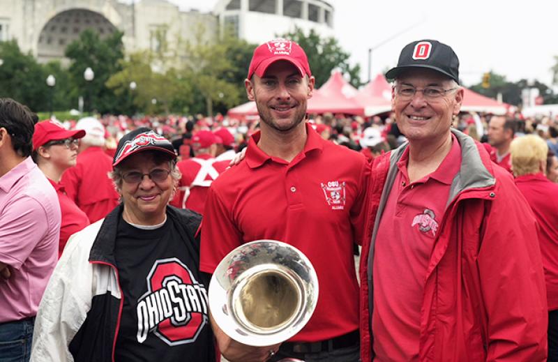 Rob Gast stands with his parents, Bob and Lynn Gast, before the Ohio State-Tulane football game on Sept. 22. Rob Gast stands with his parents, Bob and Lynn Gast, before the Ohio State-Tulane football game on Sept. 22.