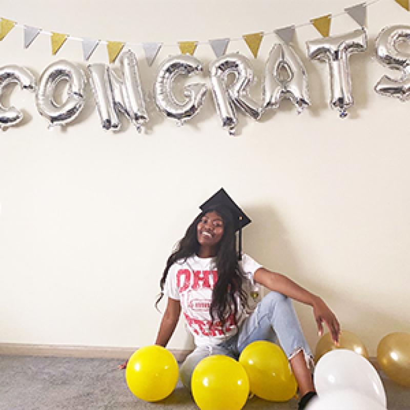 Dube poses under "Congrats" balloons Dube poses under "Congrats" balloons