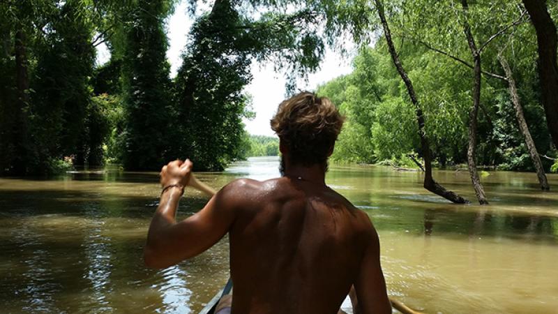 Schoessow paddles a canoe down the Mississippi River. Schoessow paddles a canoe down the Mississippi River.