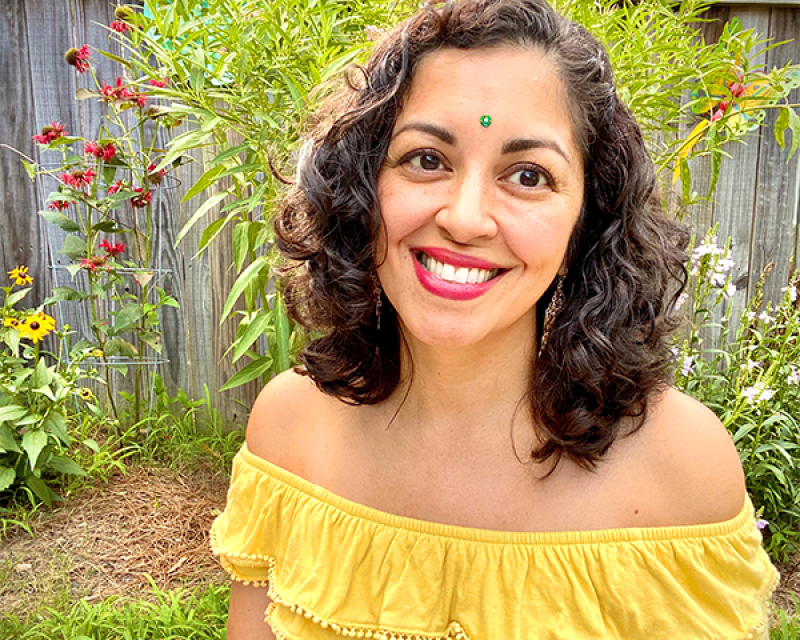 Aimee Nezhukumatathil outside in garden Aimee Nezhukumatathil outside in garden