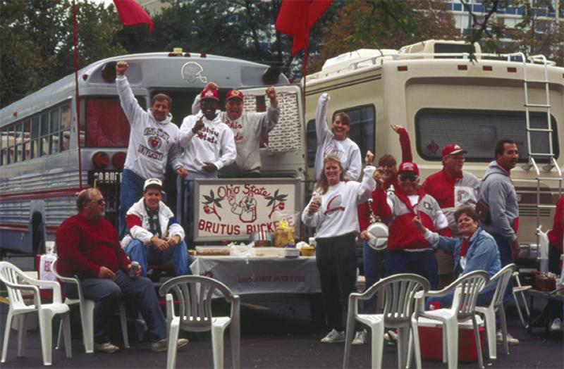 Fans tailgating at a football game in 1990. Fans tailgating at a football game in 1990.