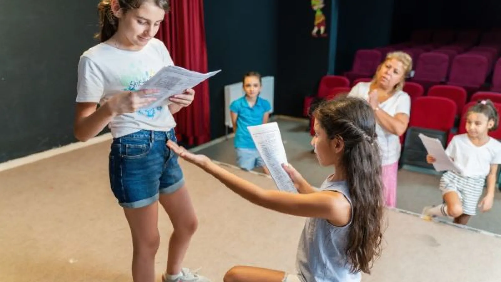 Children in a theater rehearsal