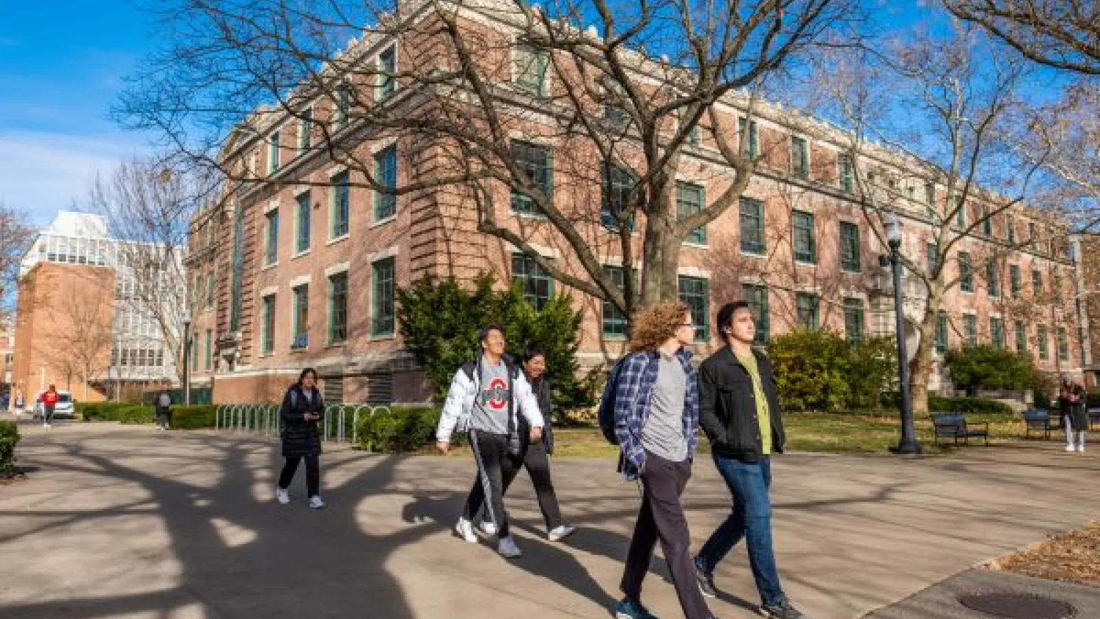 students walk past Derby Hall