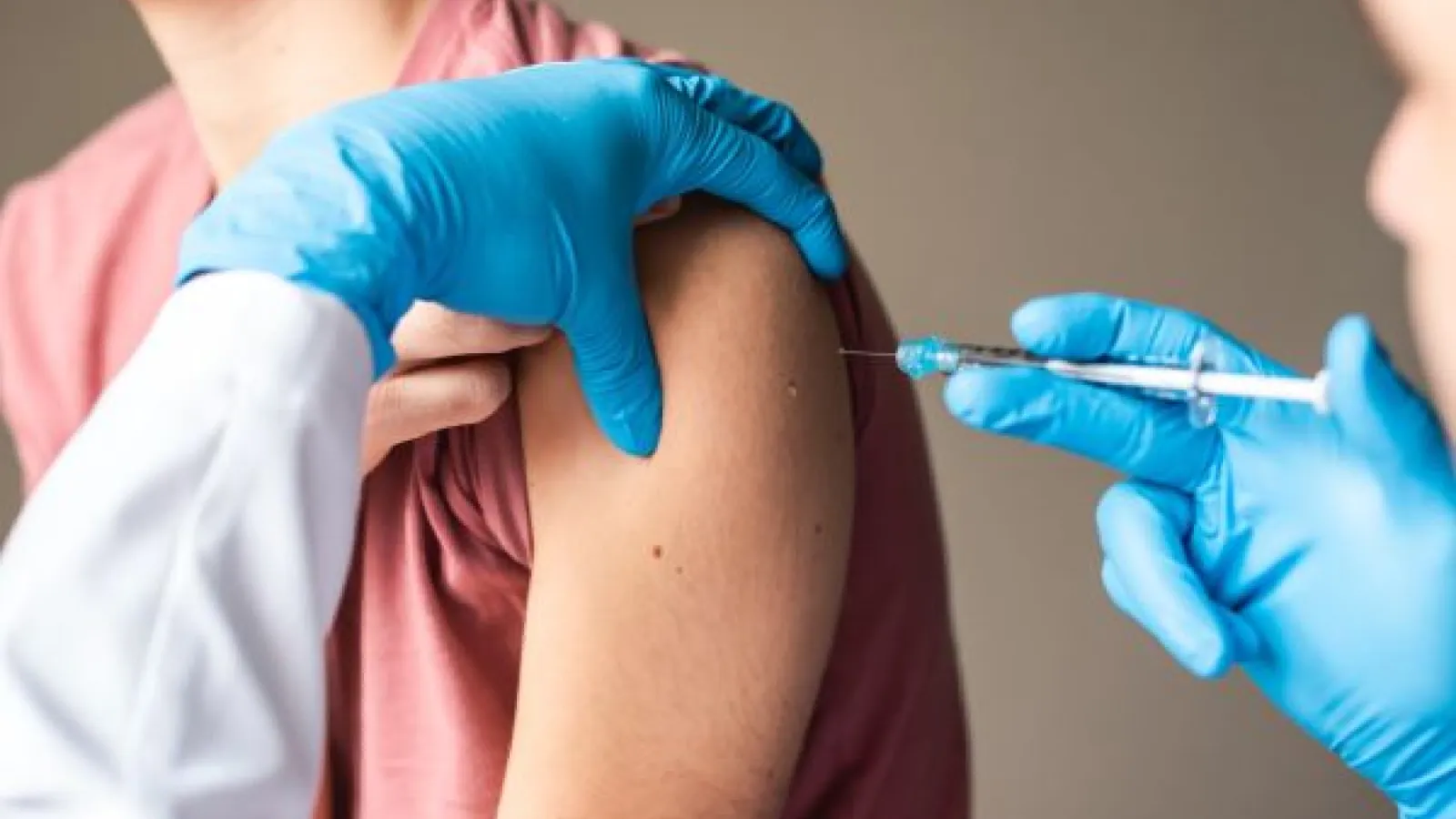 a nurse administers a vaccine
