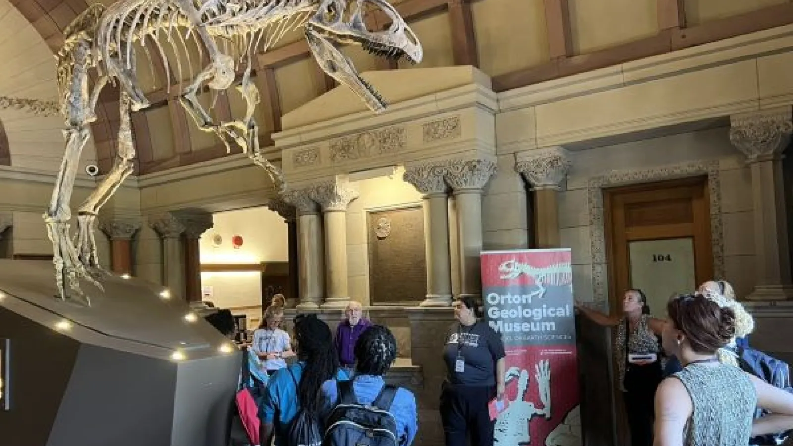 A tour of Orton Museum views the dinosaur skeleton