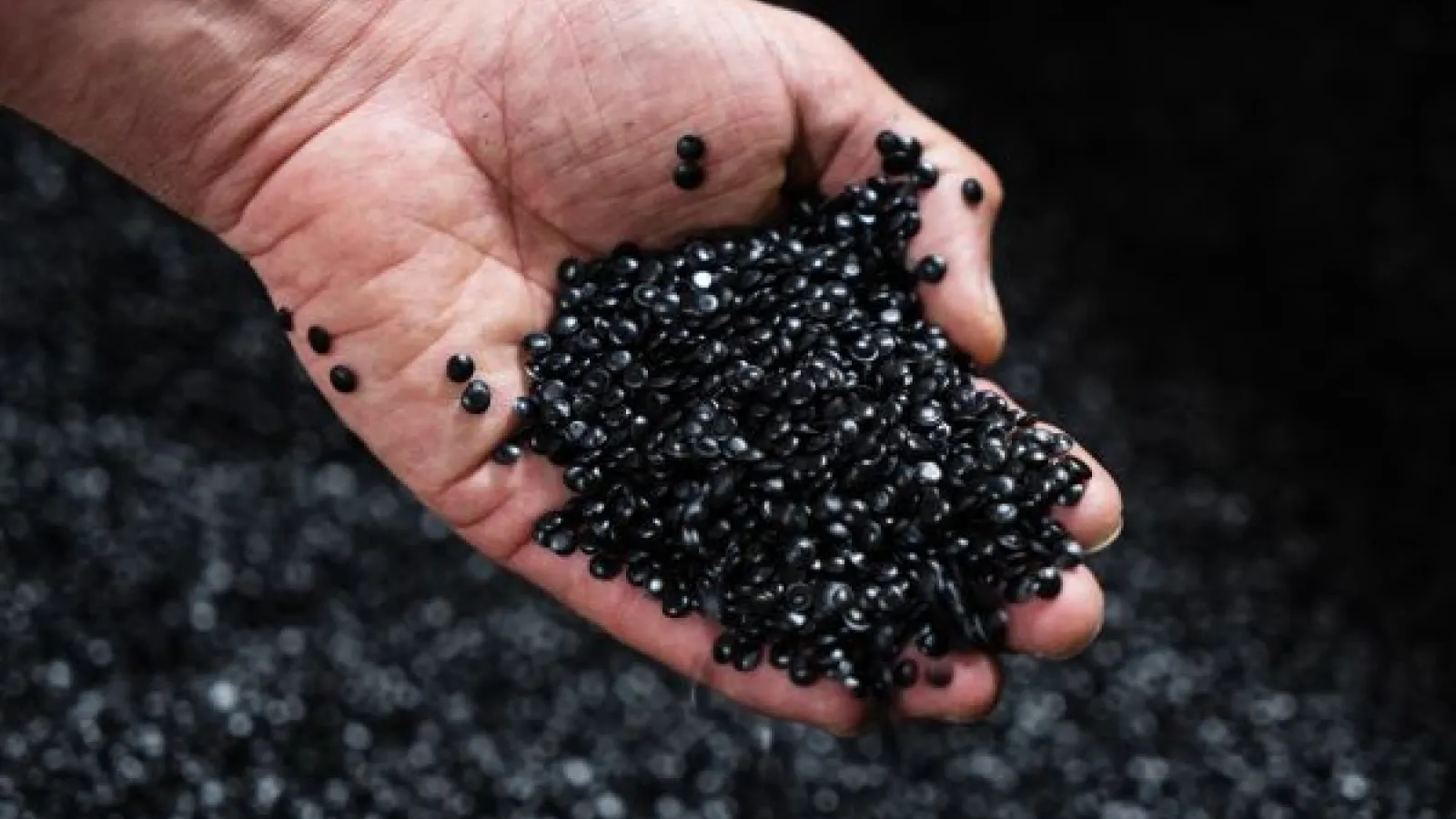 a handful of black plastic pellets