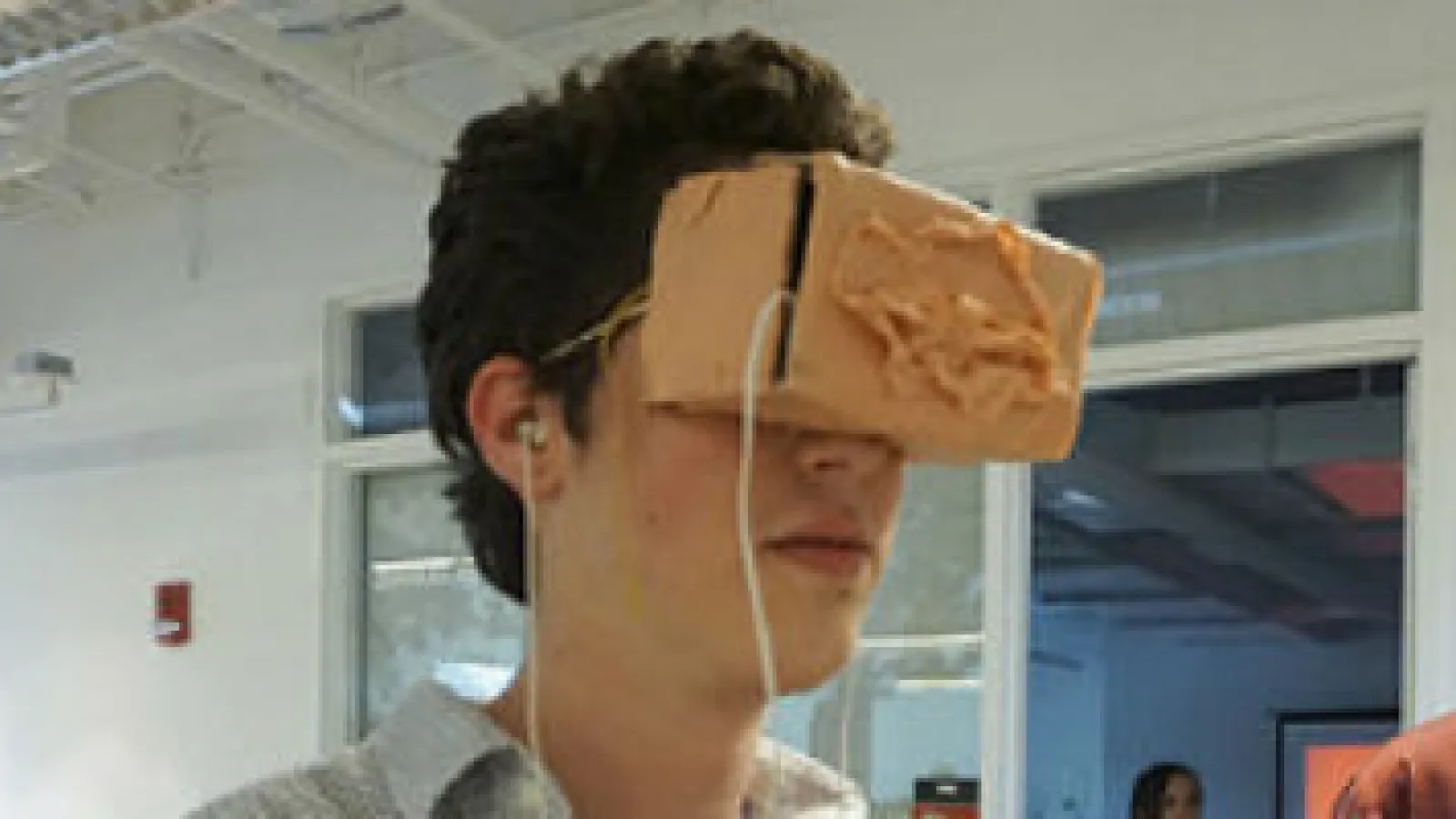 Samuel Kennard experiencing Riley Patrick’s work with Google Cardboard headset