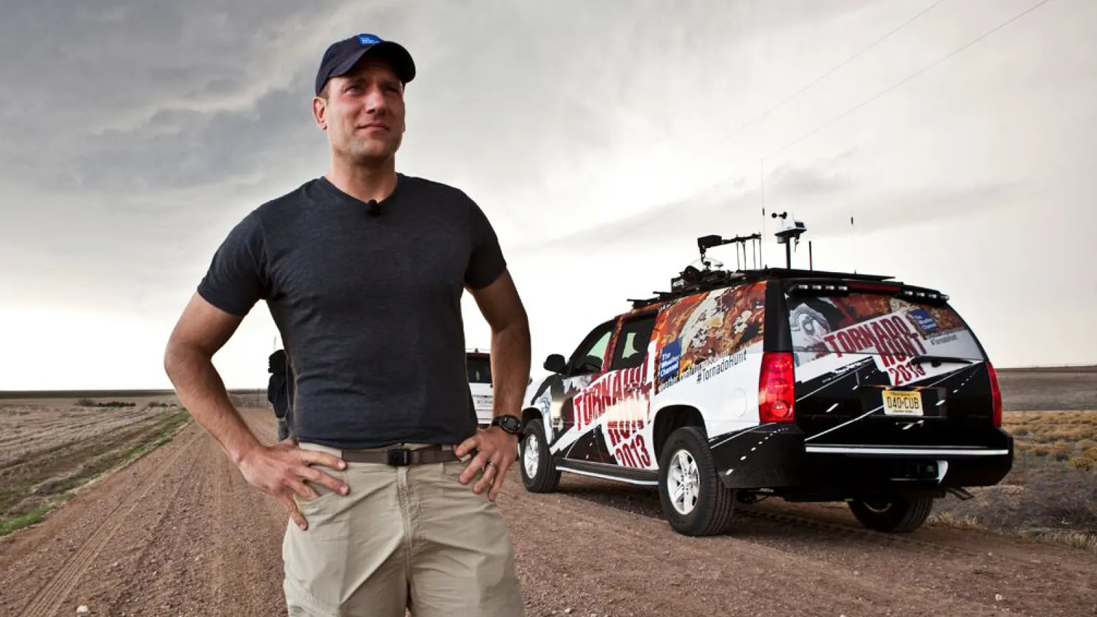 Mike Bettes looks at the sky in front of The Weather Channel Tornado Hunt vehicle