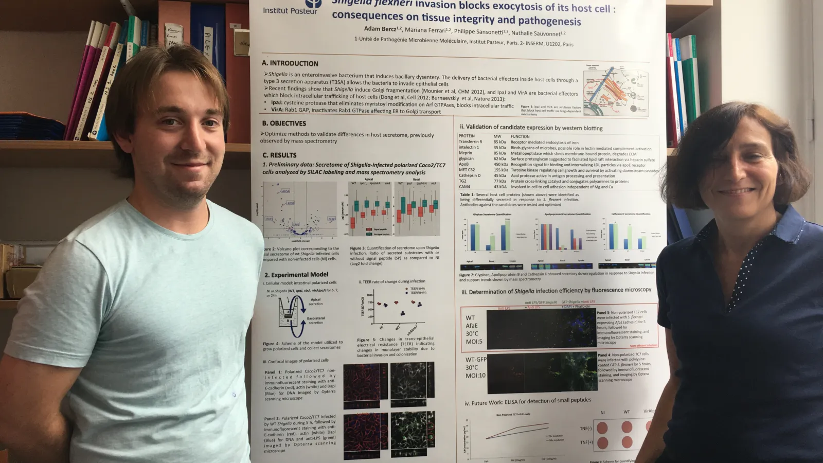 Adam Bercz stands with his principal investigator, Dr. Nathalie Sauvonnet, after preparing his poster