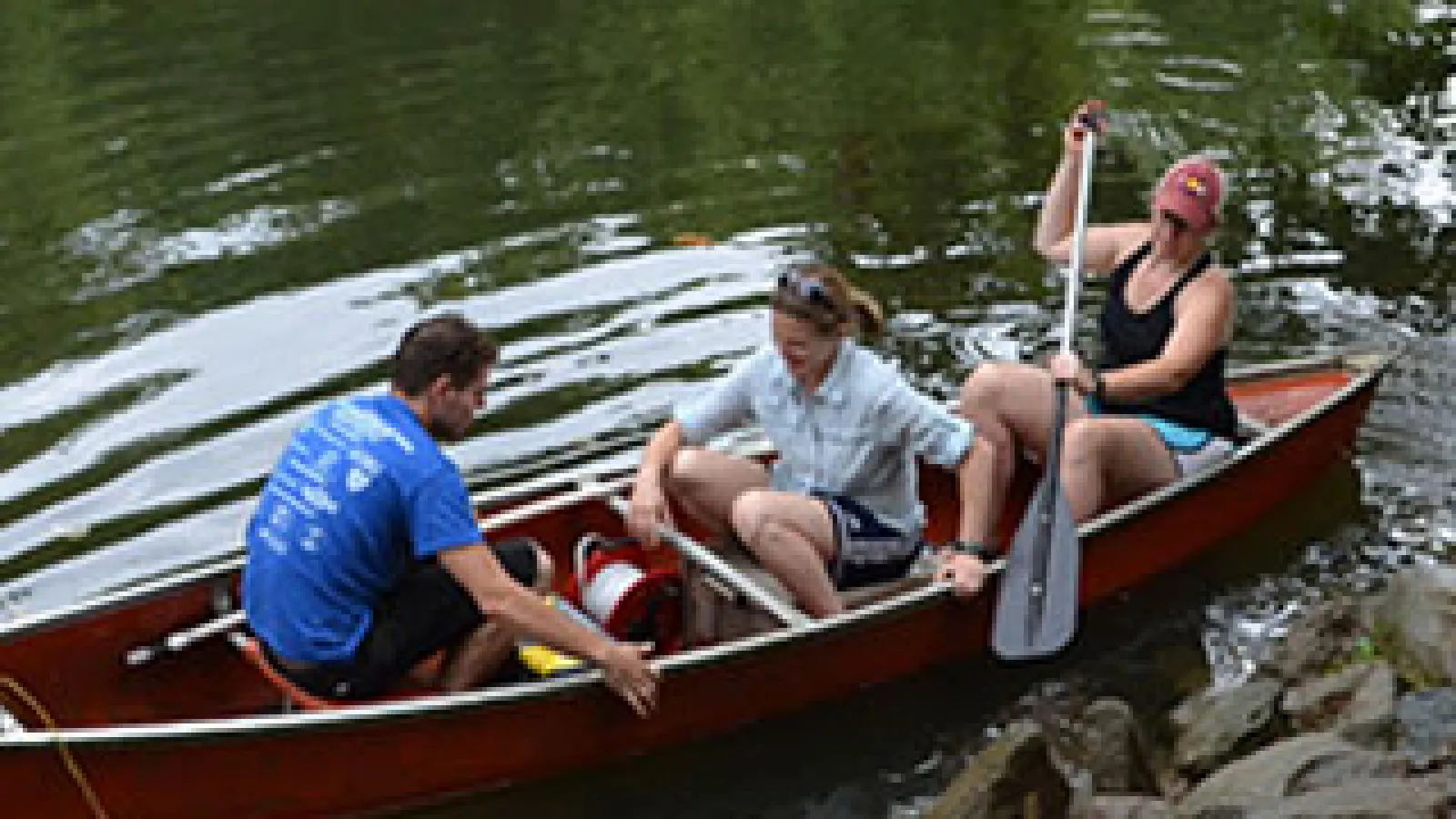 Corey Wallace; co-PI Rebecca Barnes; and Sawyer (middle), in a canoe during their first field season this past August.