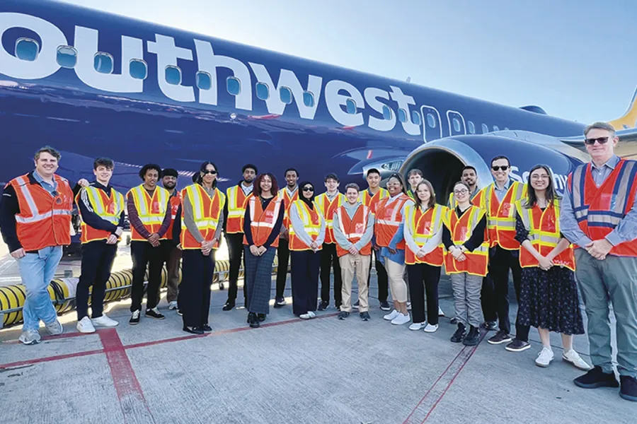 Students in front of a Southwest plane