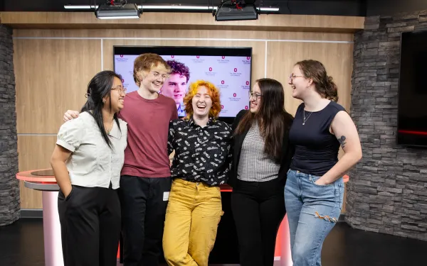 Five journalism students in The Lantern's TV studio
