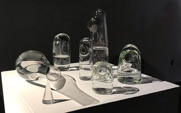 A bunch of clear glass sculptures