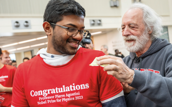 Nobel Prize winner Pierre Agostini signed t-shirts for students at a celebration in Ohio State’s Physics Research Building in March 2024.