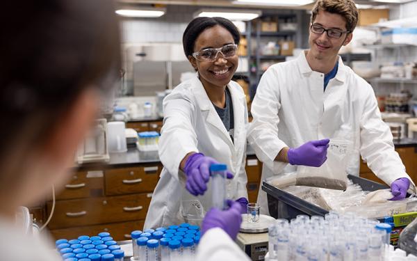 Two students working in a lab