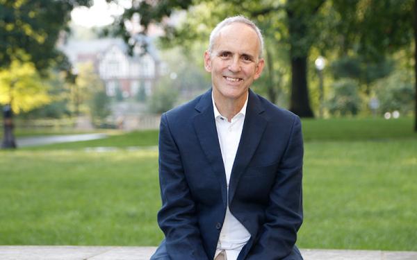 Dean Horn sitting outside in front of the Oval