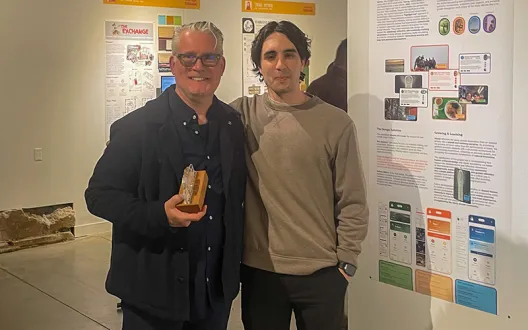 Tom and Phillip standing together in front of Phillip's project