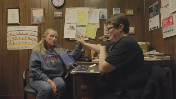 Dr. Karen Kinsell talks with a patient