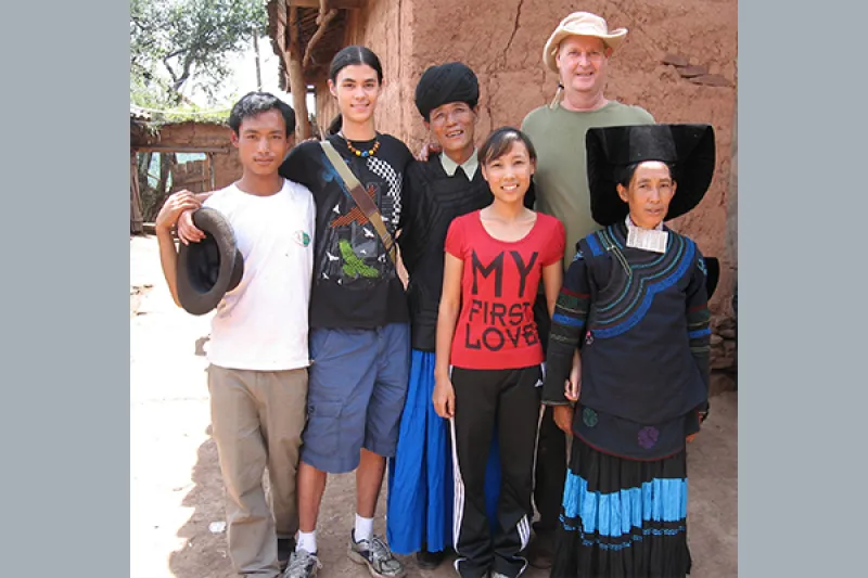 Professor Mark Bender poses with his son and an epic singer
