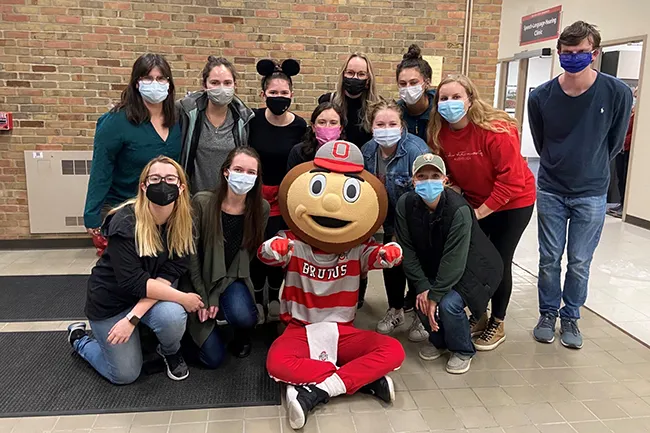 Brutus with group at Speech-Language-Hearing Clinic