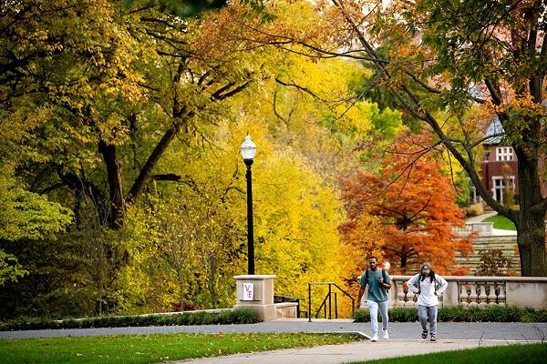 students walk across campus