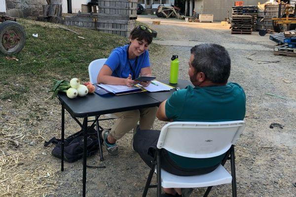 Anisa Kline interviews a farm worker