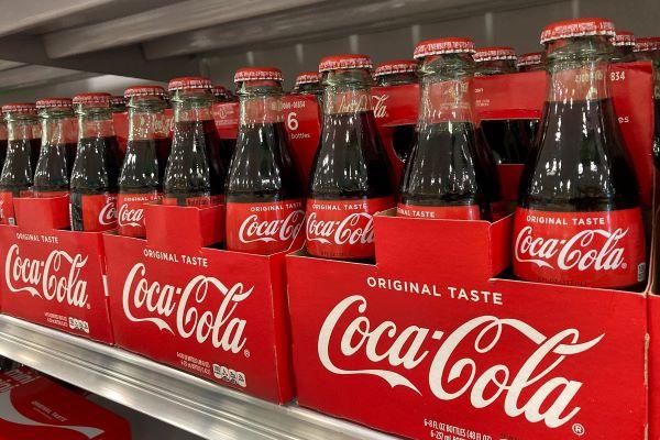 Coca Cola bottles on a shelf