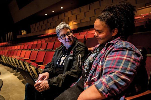 Sherée Greco collaborating with a mentee, student Skylar Kyser, in the Drake Performance and Event Center