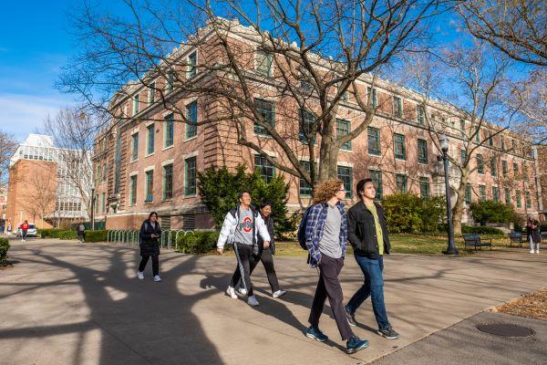 students walk past Derby Hall