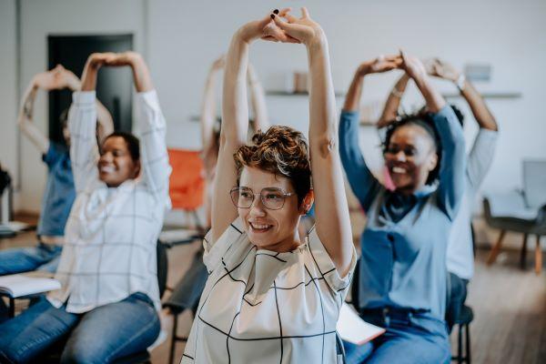 students stretch during class