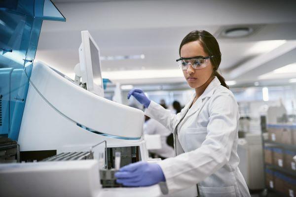 a young female researcher works in a biomedical lab