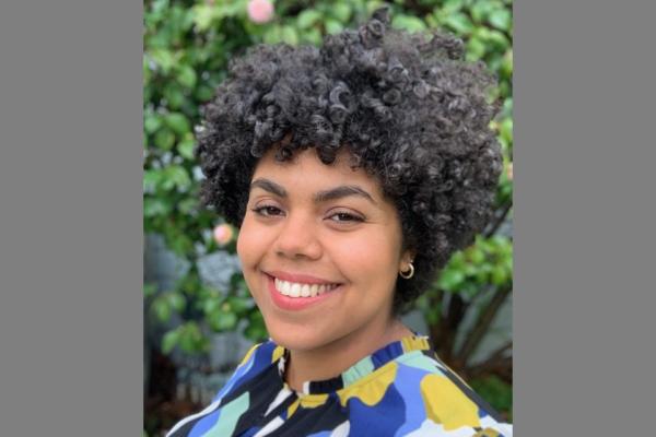 a woman with dark curly hair