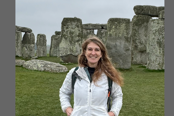 Amanda Bird standing in front of Stonehenge