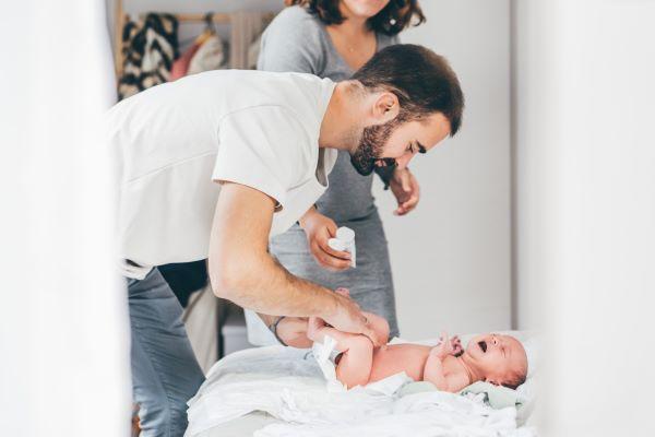 a dad taking care of a baby