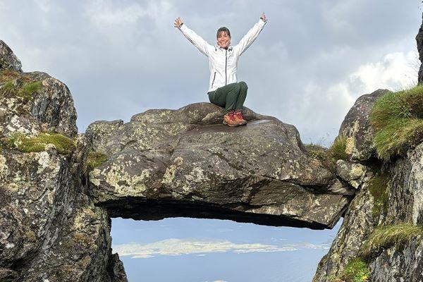Erin Murray poses on a rock formation in Norway