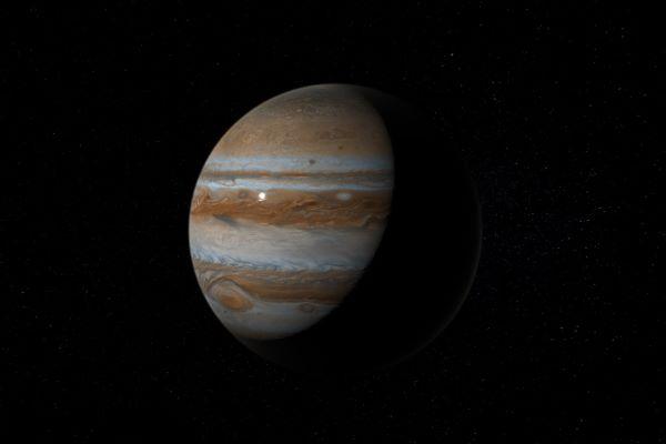 a dark shot of the planet Jupiter
