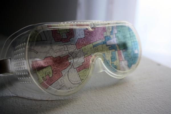 clear goggles reflecting a multicolored map