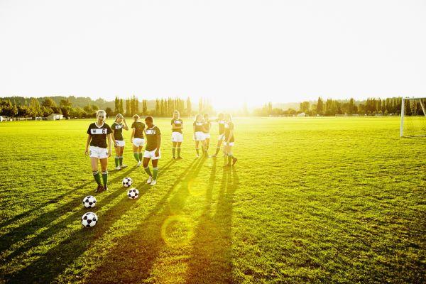 girls playing outdoor soccer